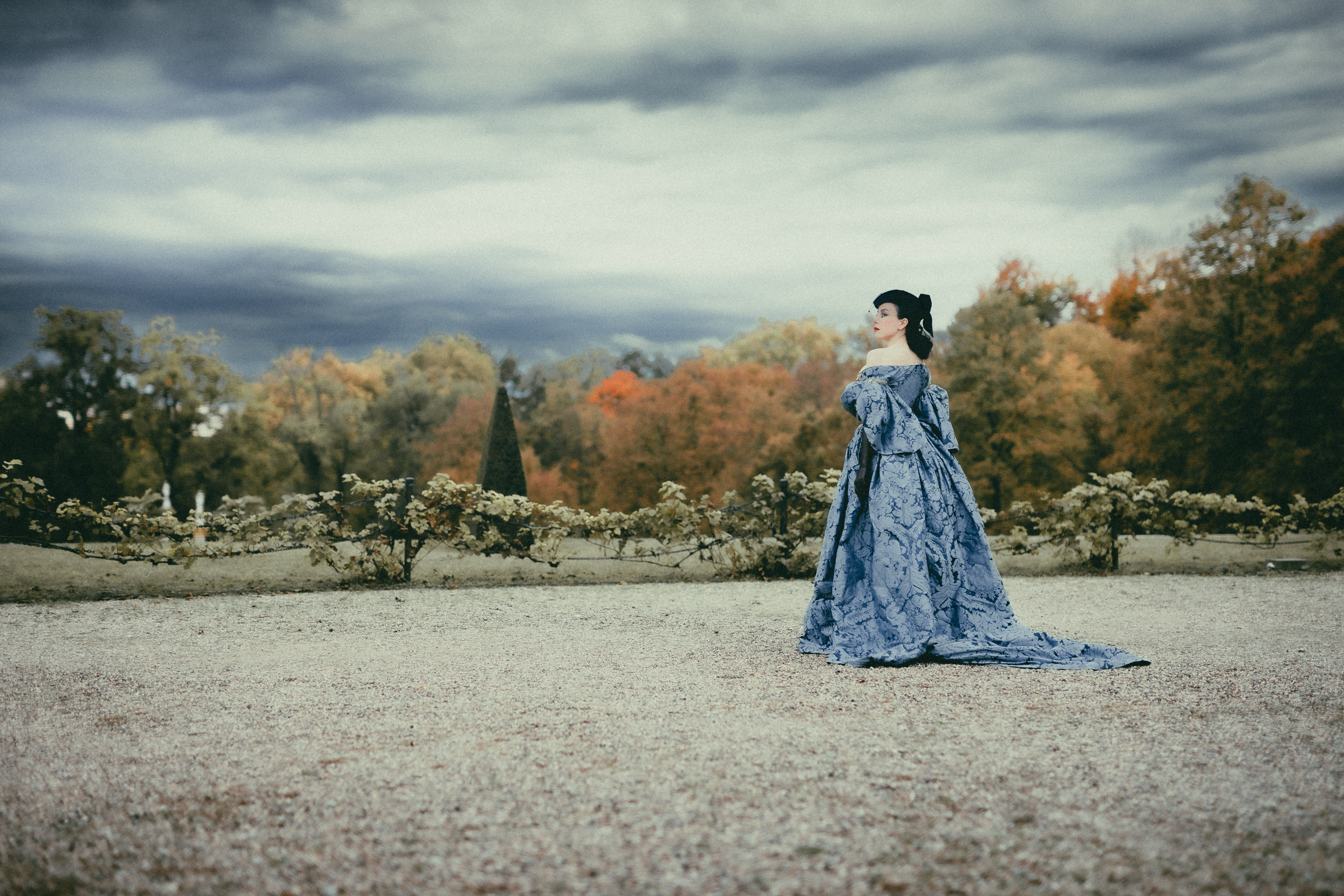 Abigail Abton in rococo costume, classical garden, Potsdam